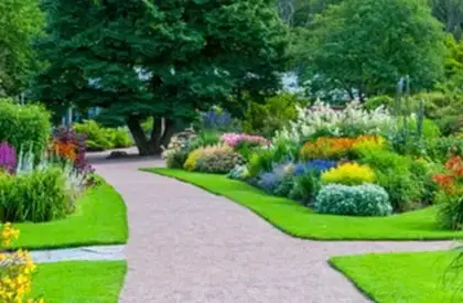 Commercial & Contract Gardening Services Perth – Beautifully landscaped garden with colorful flowers, trimmed lawns, and a clean pathway.