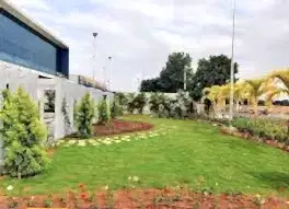 Commercial & Contract Gardening Services Perth – Well-maintained corporate landscape with lush green lawn, trees, and decorative plants.
